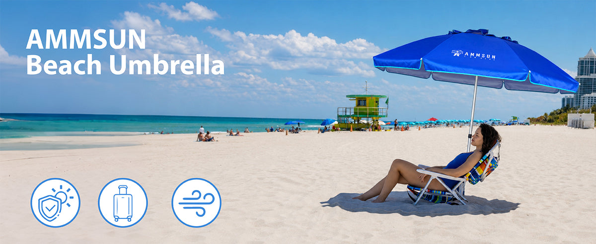 A blue AMMSUN 6.5ft beach umbrella for sand with anchor on beach with a woman reclining in a lounge chair underneath