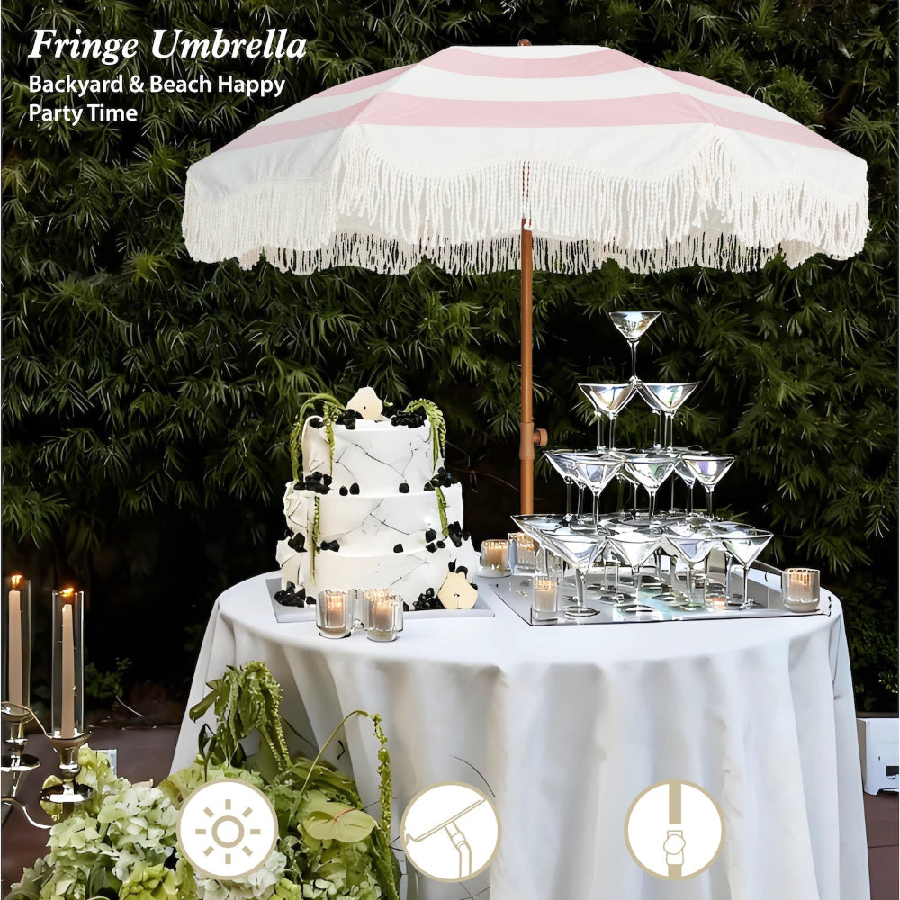 AMMSUN 6.5ft pink stripe fringe umbrella outdoor patio over a table with a cake and glass pyramid