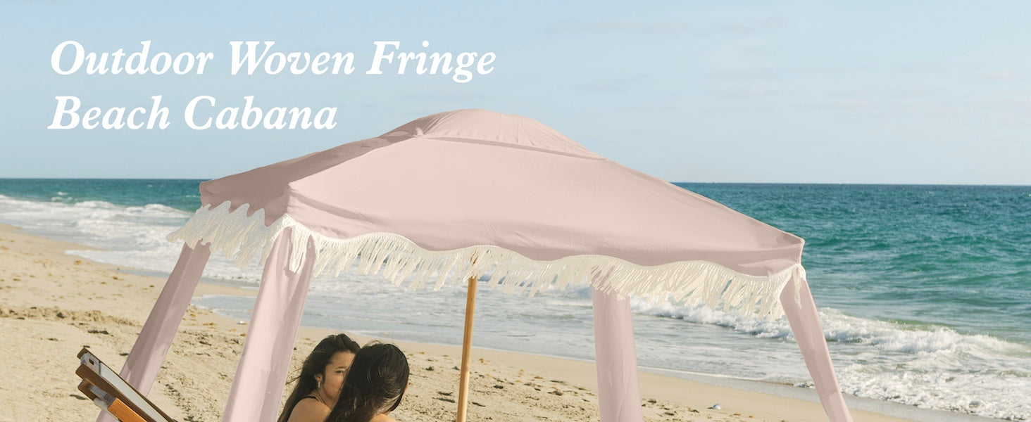 Two women relaxing under an AMMSUN 7'x7' Pink Coral coolcabana beach tent with fringe boho beach cabana with premium wood pole