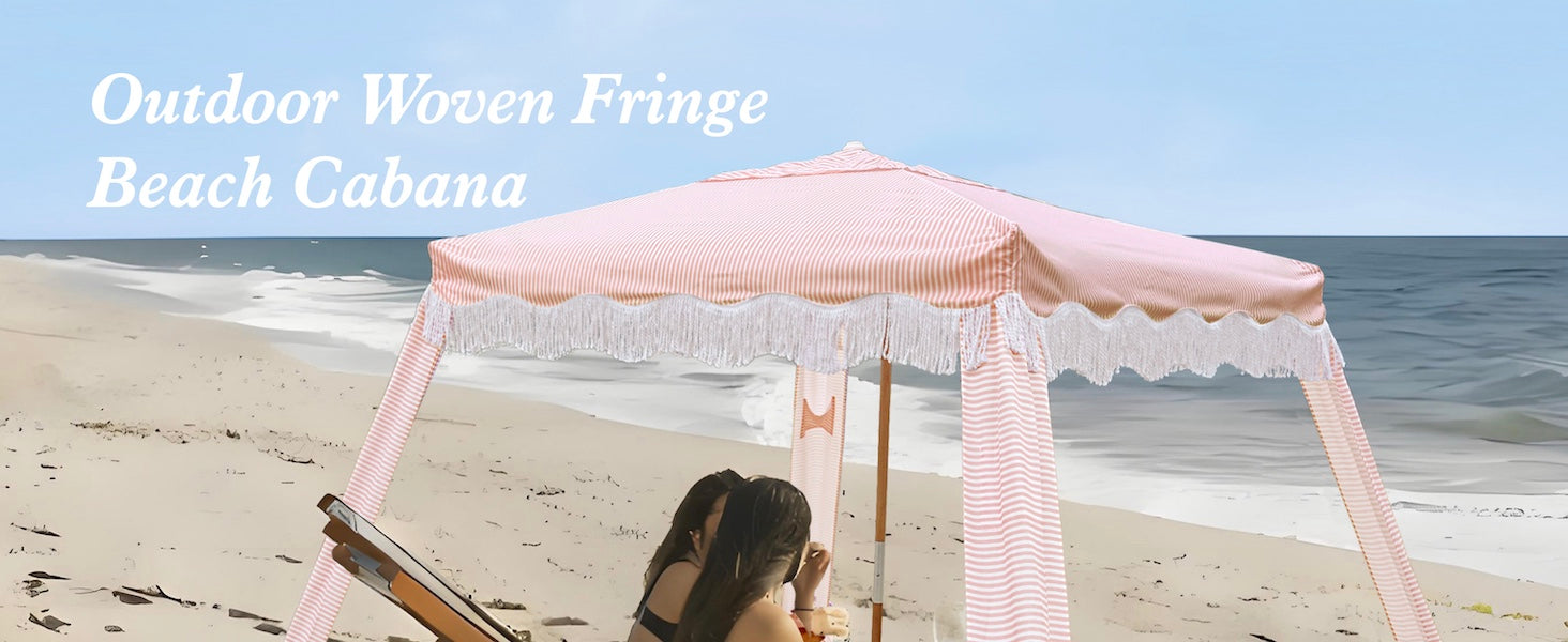 Two women relaxing under an AMMSUN 7'x7' Pink stripes fringe umbrella with tassel boho beach cabana with premium wood pole