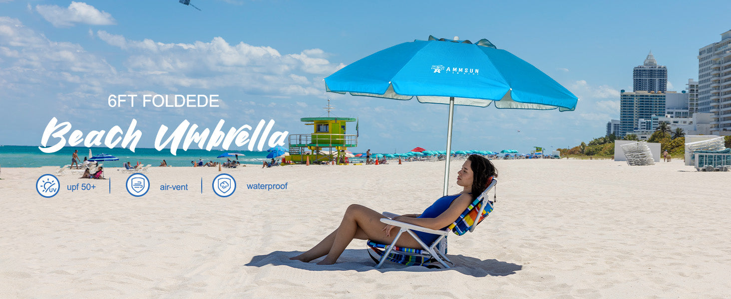 A woman is sitting under AMMSUN 6ft sky blue folded shade umbrella portable with anchor, enjoying holiday