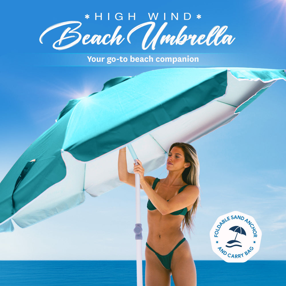 A teal AMMSUN 7ft vibrant beach umbrella adjusting in high winds, with a sandy shore and turbulent sea nearby. Beach umbrellas for sand，Floating table umbrella，Beach umbrella with table，Portable beach umbrella