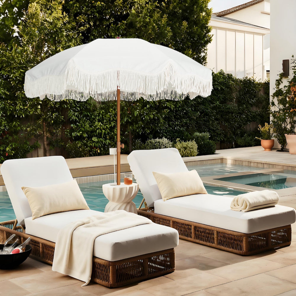 Two white lounge chairs with an AMMSUN 6.5ft boho fringe small beach umbrella for picnic table umbrellas by poolside.