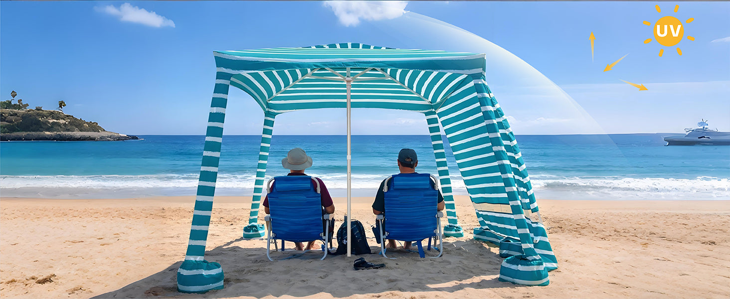 Two people sitting under an AMMSUN 8'x8' green stripes portable camping sun shelters for beach canaba with sunwall