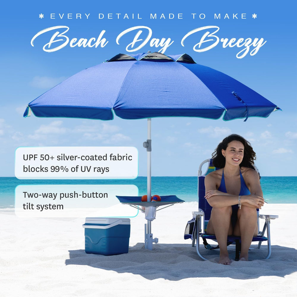 A woman sitting under an AMMSUN 7ft built-in table heavy duty beach umbrella with sand anchor