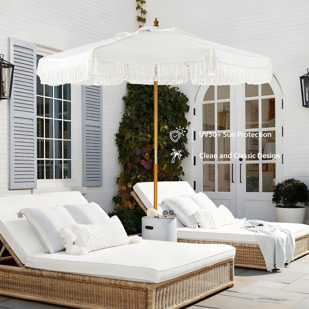 AMMSUN 8.5ft white patio umbrella with fringe for wooden umbrella pulley lift over two lounge chairs on a patio.