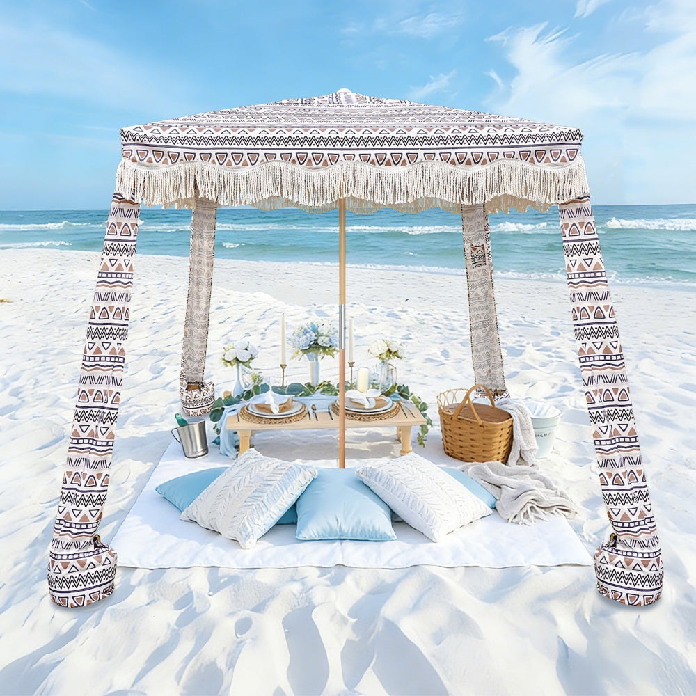 An AMMSUN 7ftx7ft tan boho canopy beach canopy easy setup with white fringe on beach