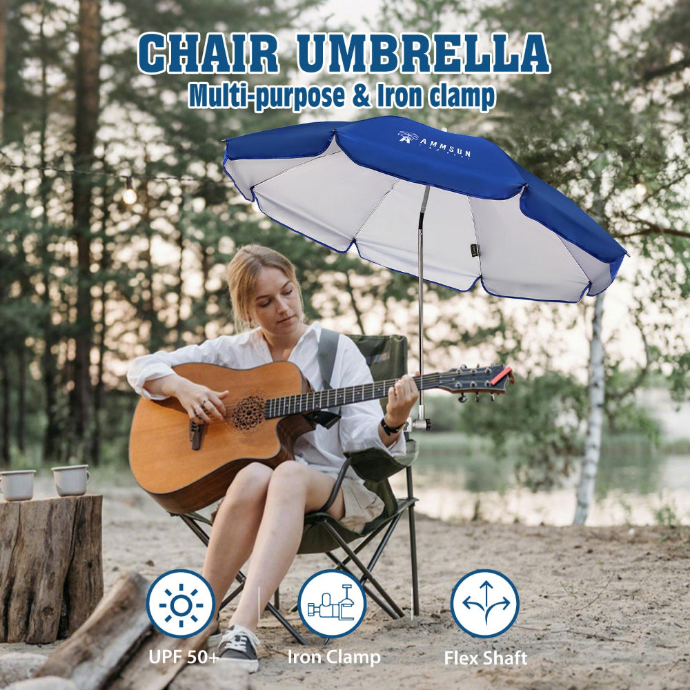 A woman sits in a chair with an AMMSUN blue bleacher umbrella for stadiums with clamp by the lake