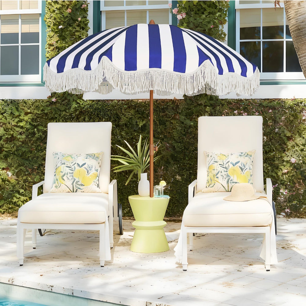 Two white chairs with AMMSUN 6.5ft boho fringe backyard umbrella for outdoor with tassel by a pool.