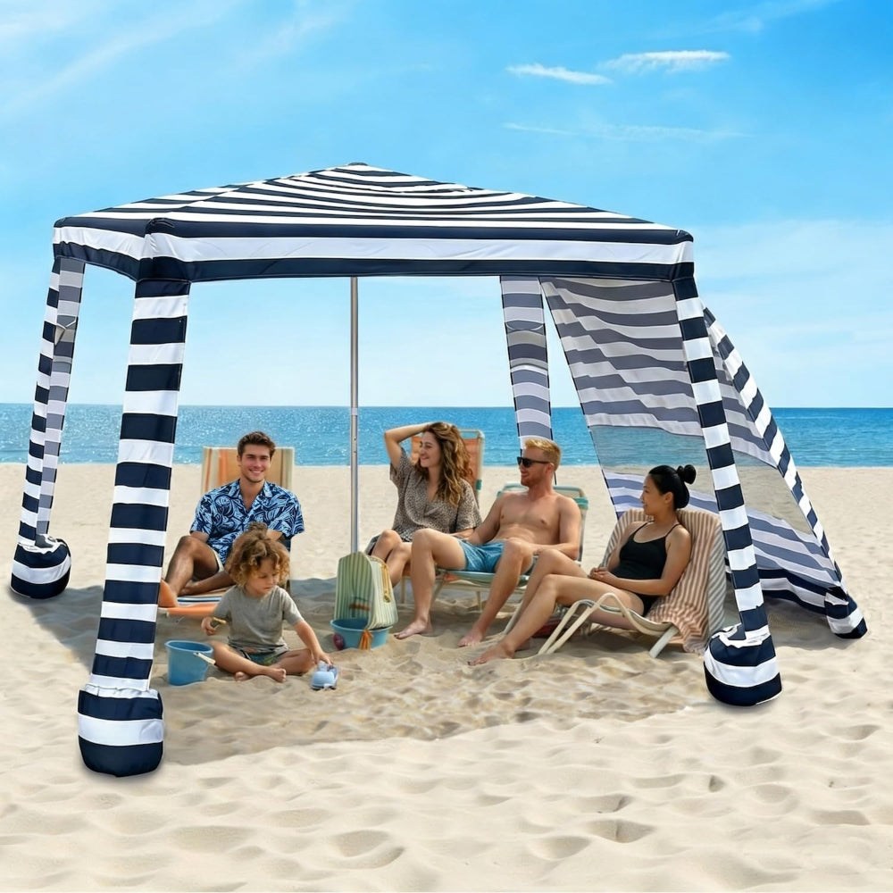 A family of 5 sitting under an AMMSUN 8'x8' large camping canopy with sunwall for beach cabana tent