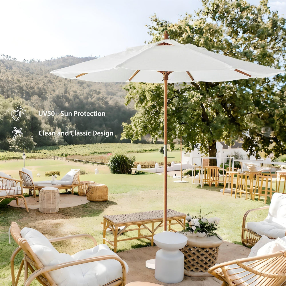 A large AMMSUN white sombrillas de playa for outdoor umbrella with pulley lift, chairs, and tables in a garden.