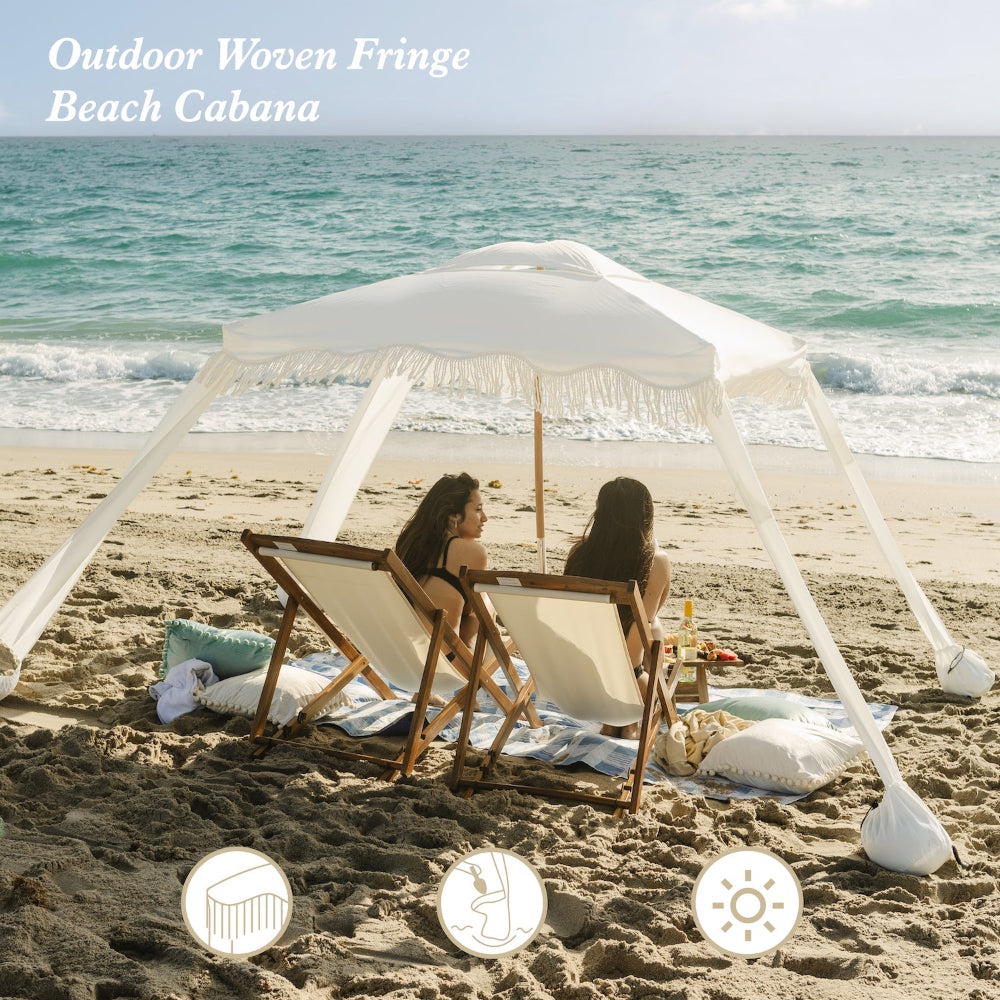 women sitting under AMMSUN 6'×6' Elegant white Bobo Beach Cabana with Fringe on the beach