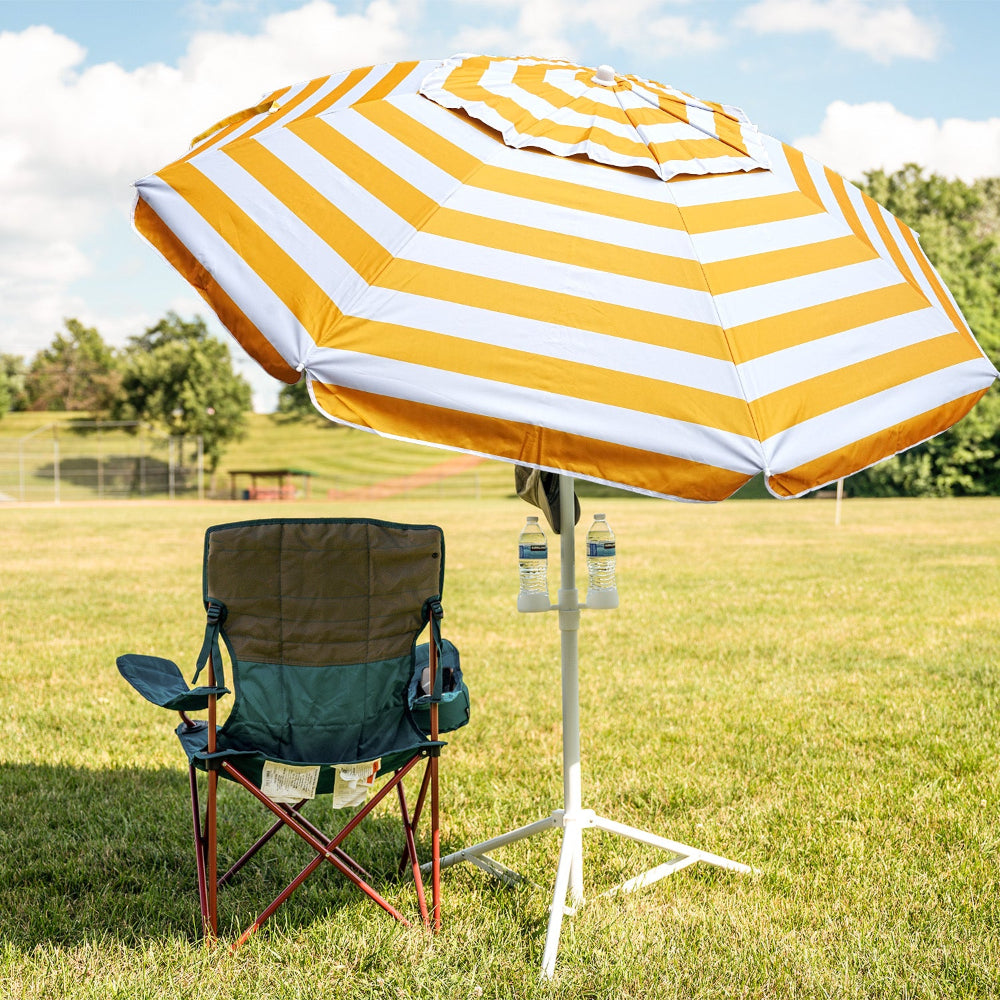 AMMSUN 6.5ft patio umbrella with base included with a chair and bottles on a grassy field