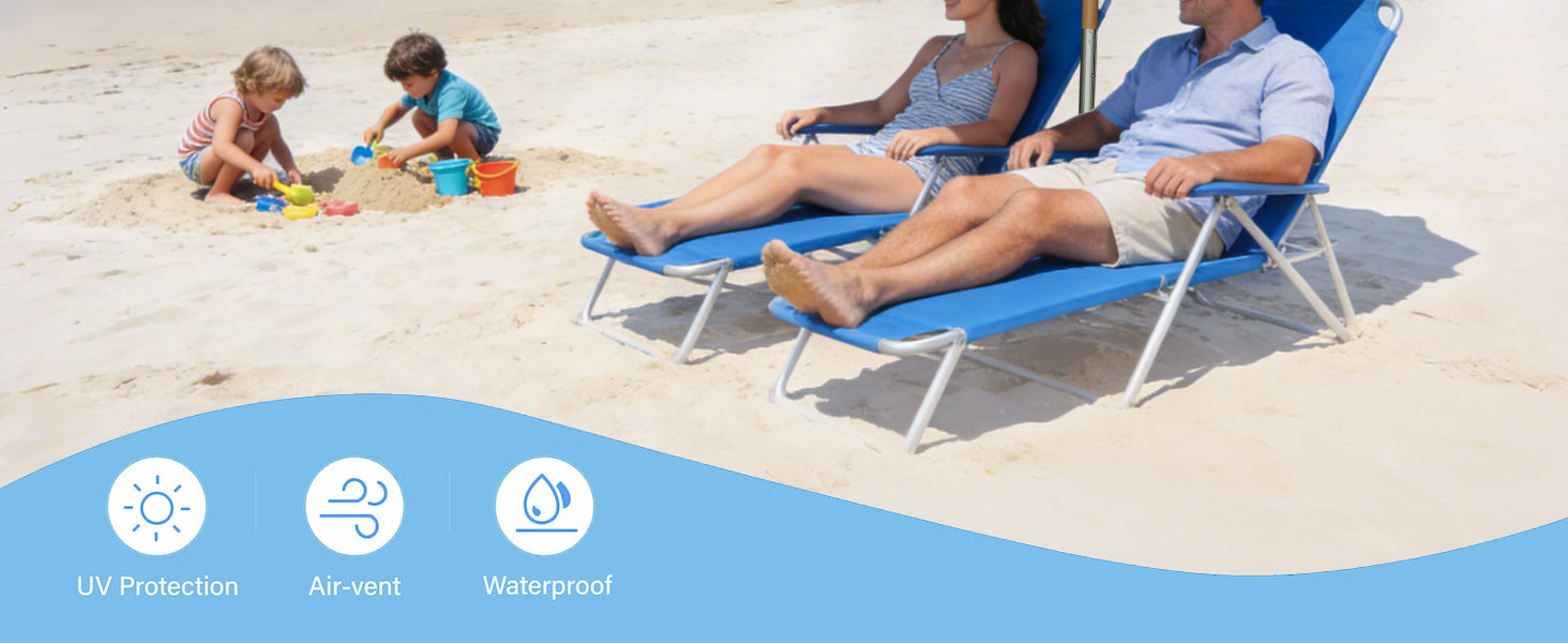 Family on blue beach chairs with children playing on the sandy beach