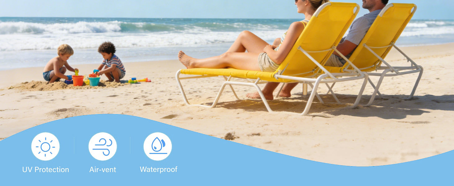 Family on yellow beach chairs with children playing in the sand