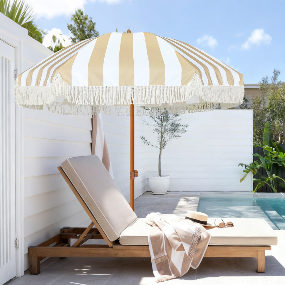 AMMSUN beige stripes outdoor umbrellas for patio with fringe and lounge chair by a poolside