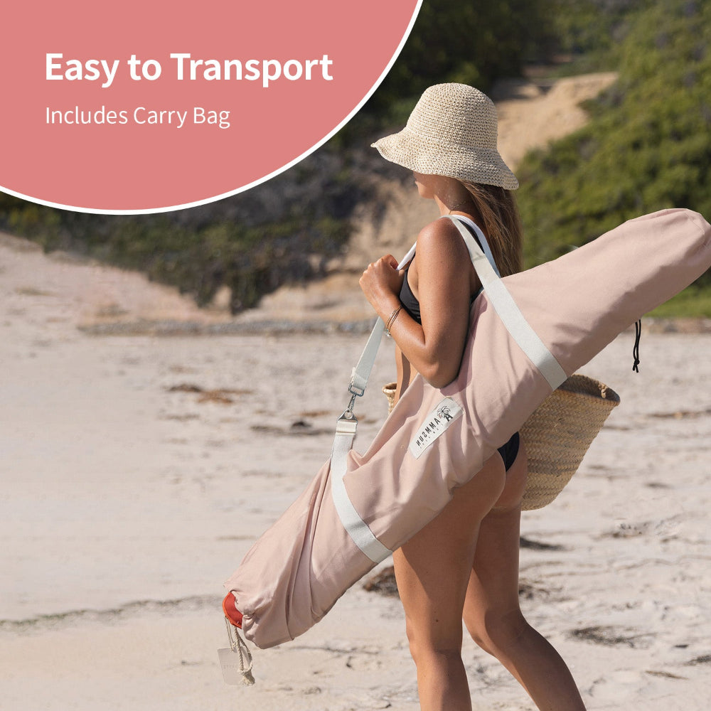 A woman holding an easy-to-transport carry bag for AMMSUN 7.8ft pool umbrella for inside of pool