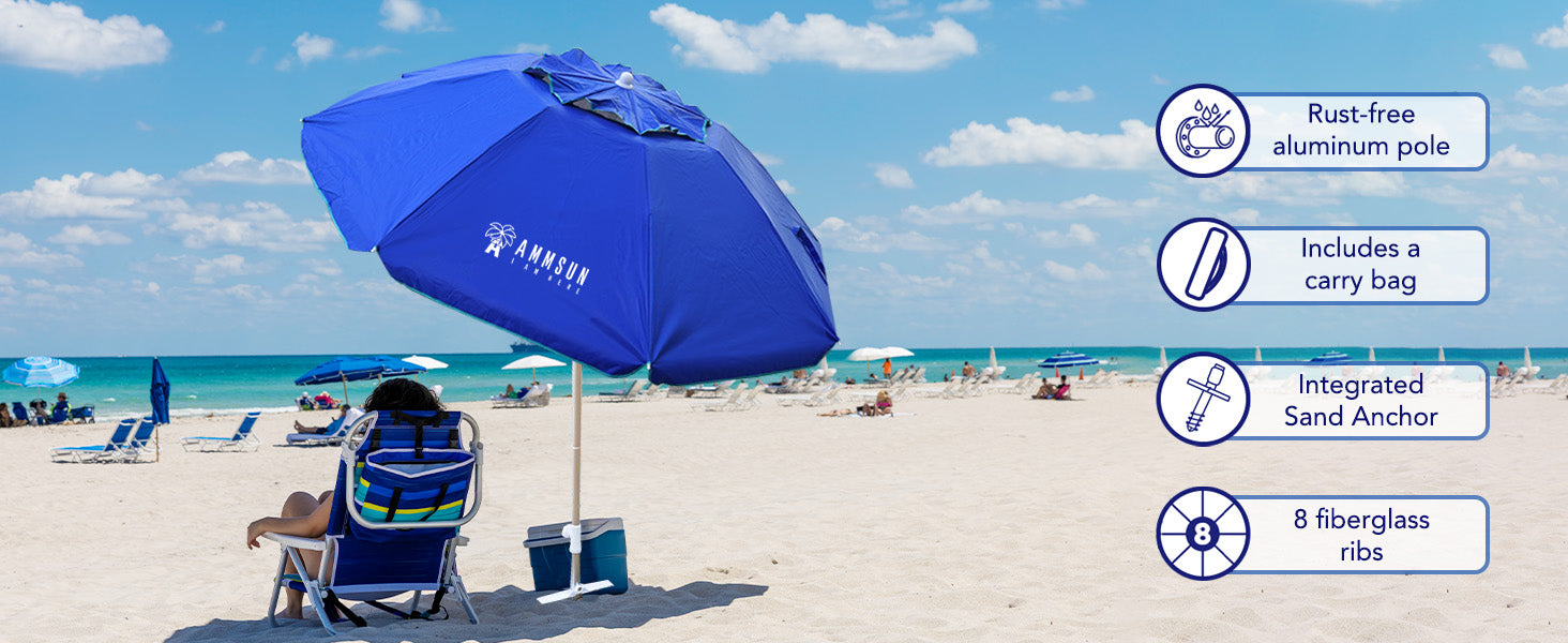 A woman sitting under AMMSUN 6.5ft blue folded UV 50+ portable beach umbrella with anchor, featuring tilt and air-vent