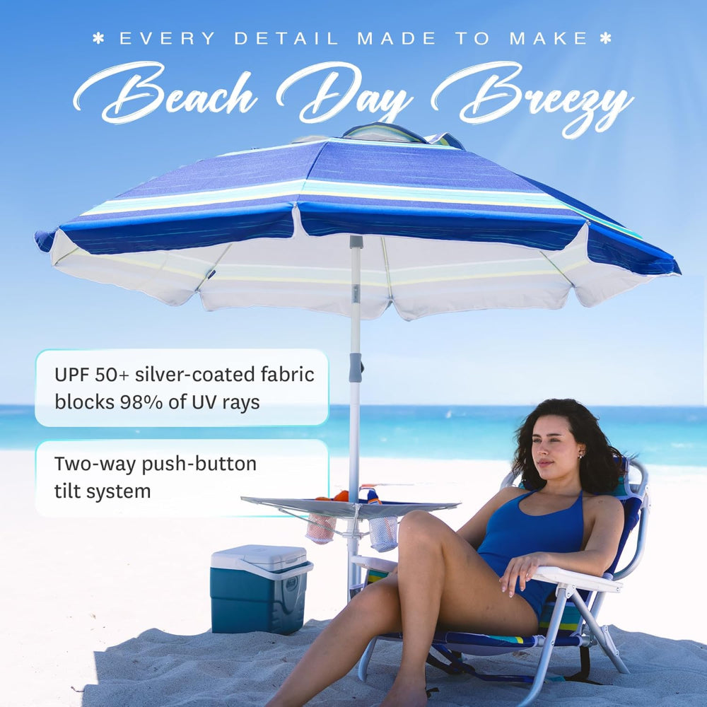 A woman sheltered by AMMSUN 7ft blue stripes umbrella for beach with stand and table tray