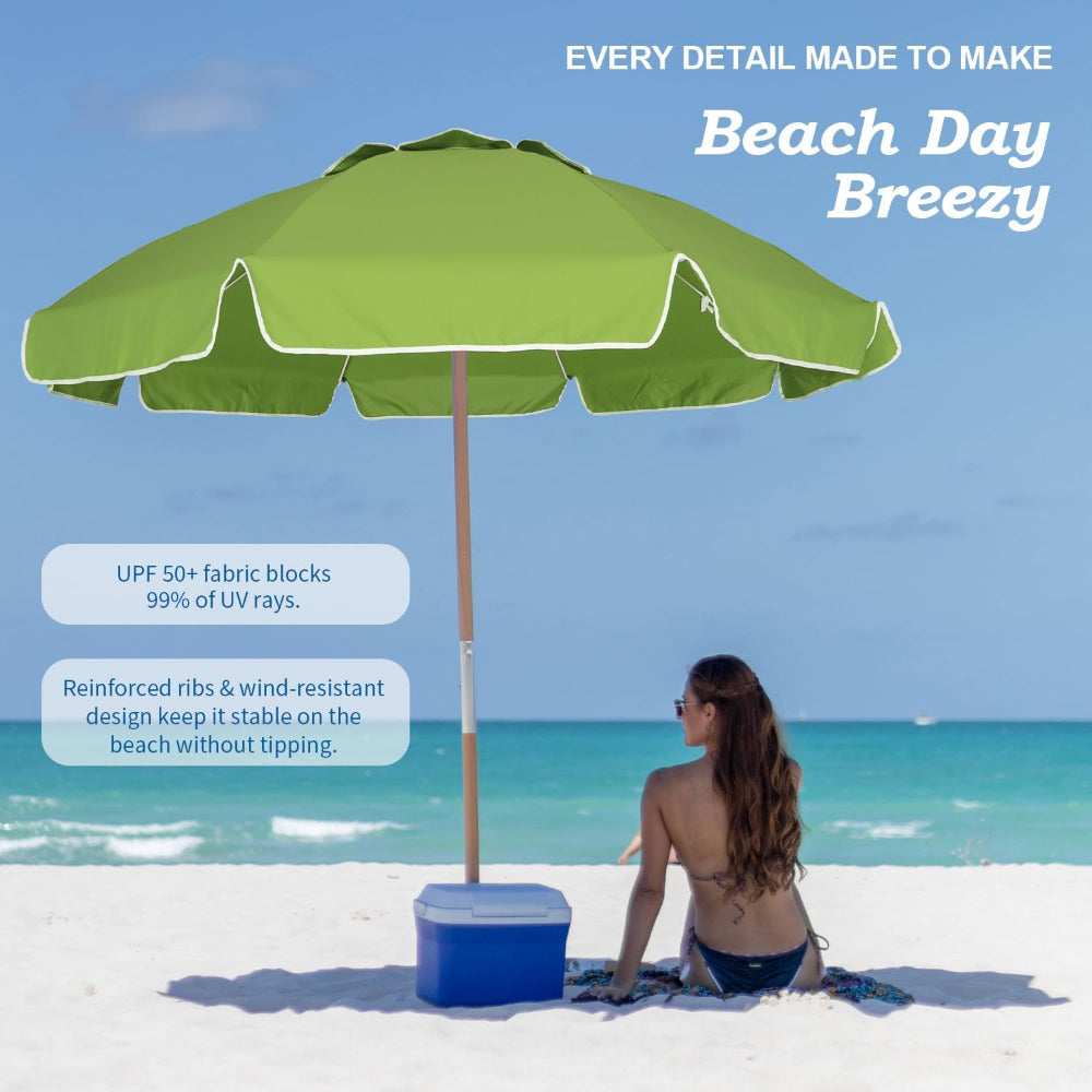 Ammsun 7.5ft yellow commercial grade portable beach umbrella with a person sitting under it on a sandy beach.