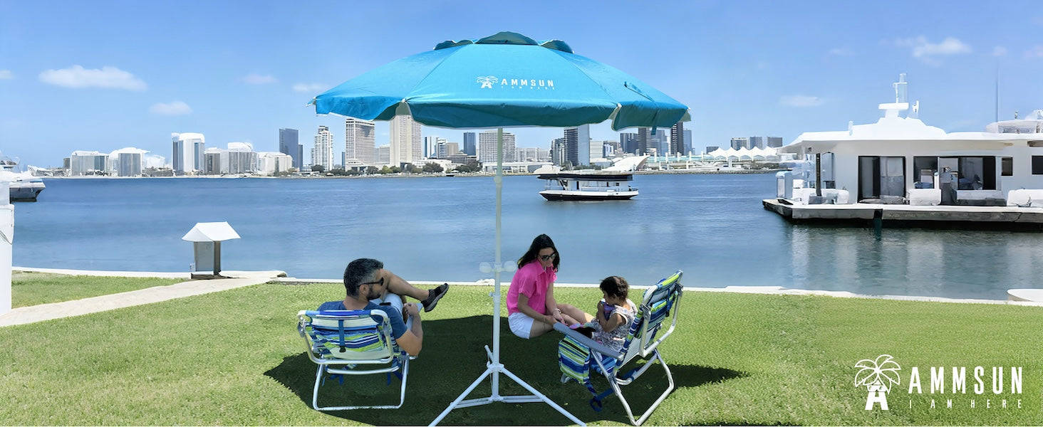 Family sitting under an AMMSUN 6.5ft blue sun umbrella uv protection with tilt portable umbrella with stand by the lake