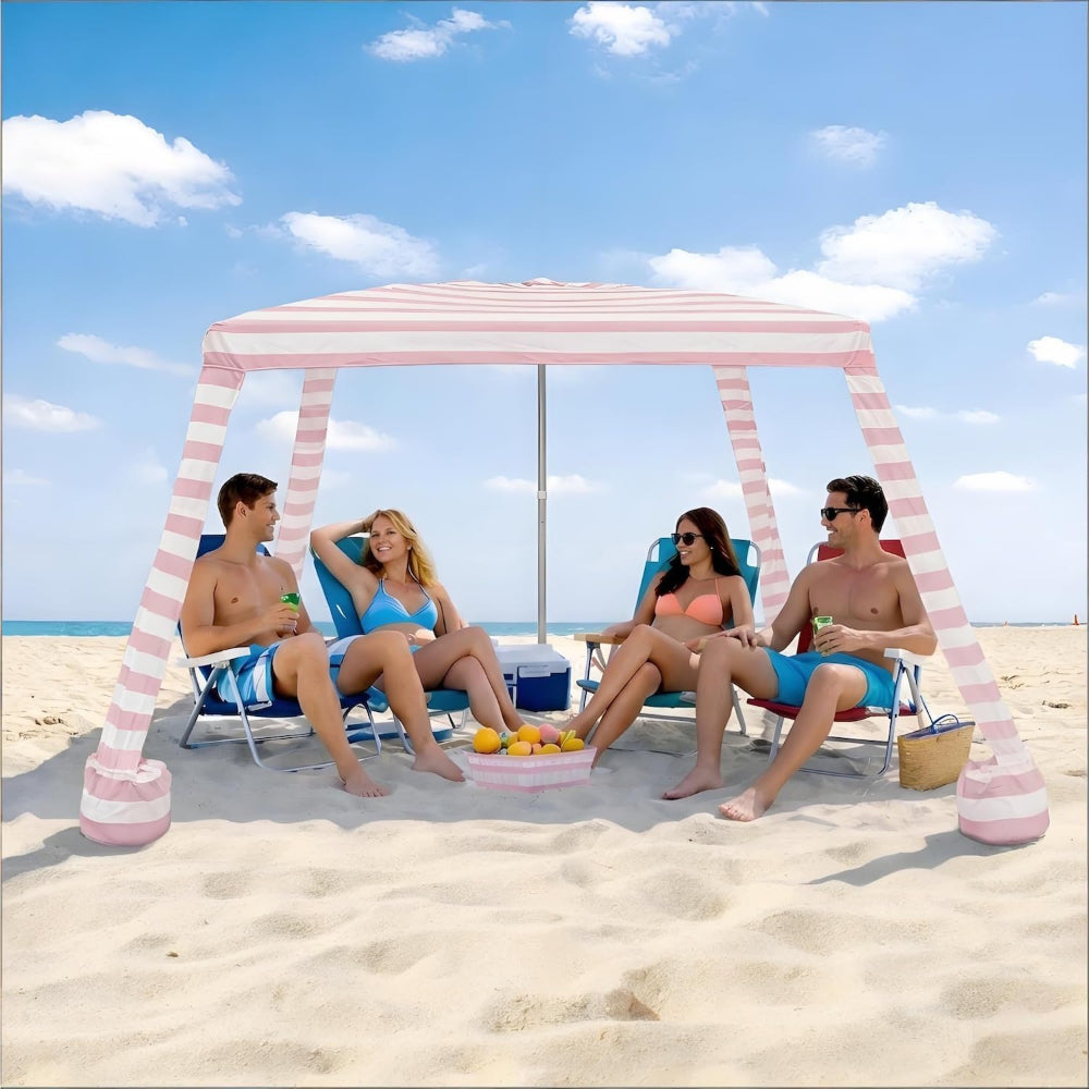 4 people having beach time under an AMMSUN 8'x8' easy up canopy beach cabana with privacy sunwall