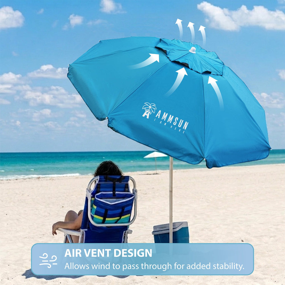 A woman sitting under an AMMSUN 6.5FT light blue folded beach umbrella with sand anchor