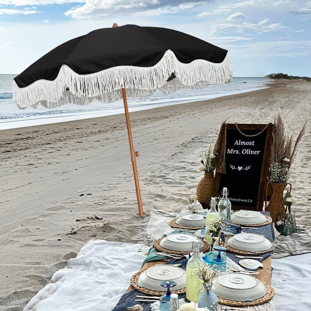 AMMSUN 6.5ft Noble Black picnic table umbrellas for outside with tassels providing shade on beach