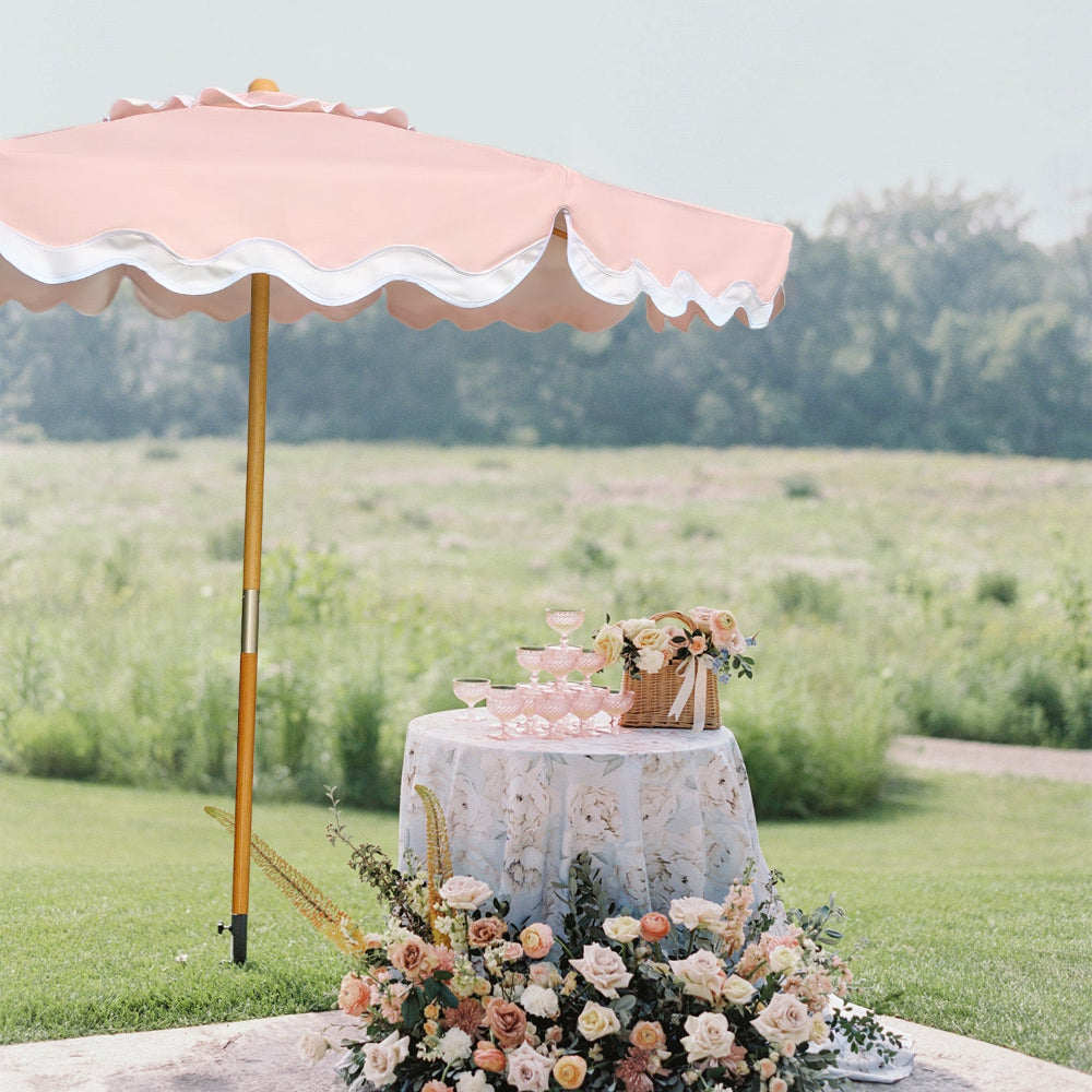 An AMMSUN Deep Peach 8ft seashell umbrella for picnic table umbrella, providing shade on grass