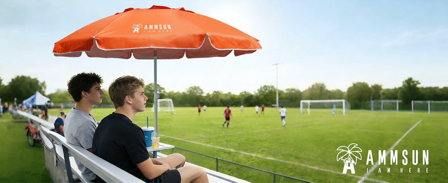 Two people sitting under an AMMSUN 6.5ft orange best umbrella lightweight portable umbrella with stand for sports