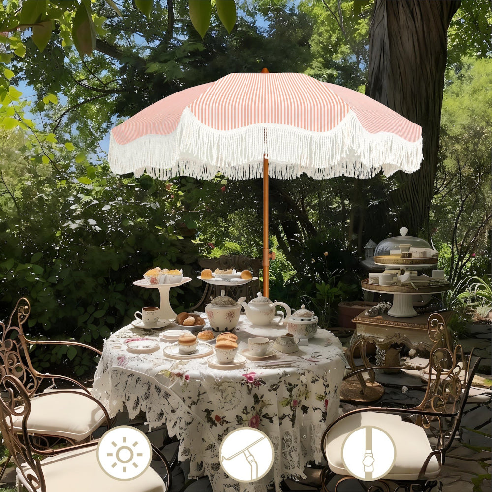 Outdoor setting with an AMMSUN boho umbrella outdoor umbrellas for patio over a table set for tea