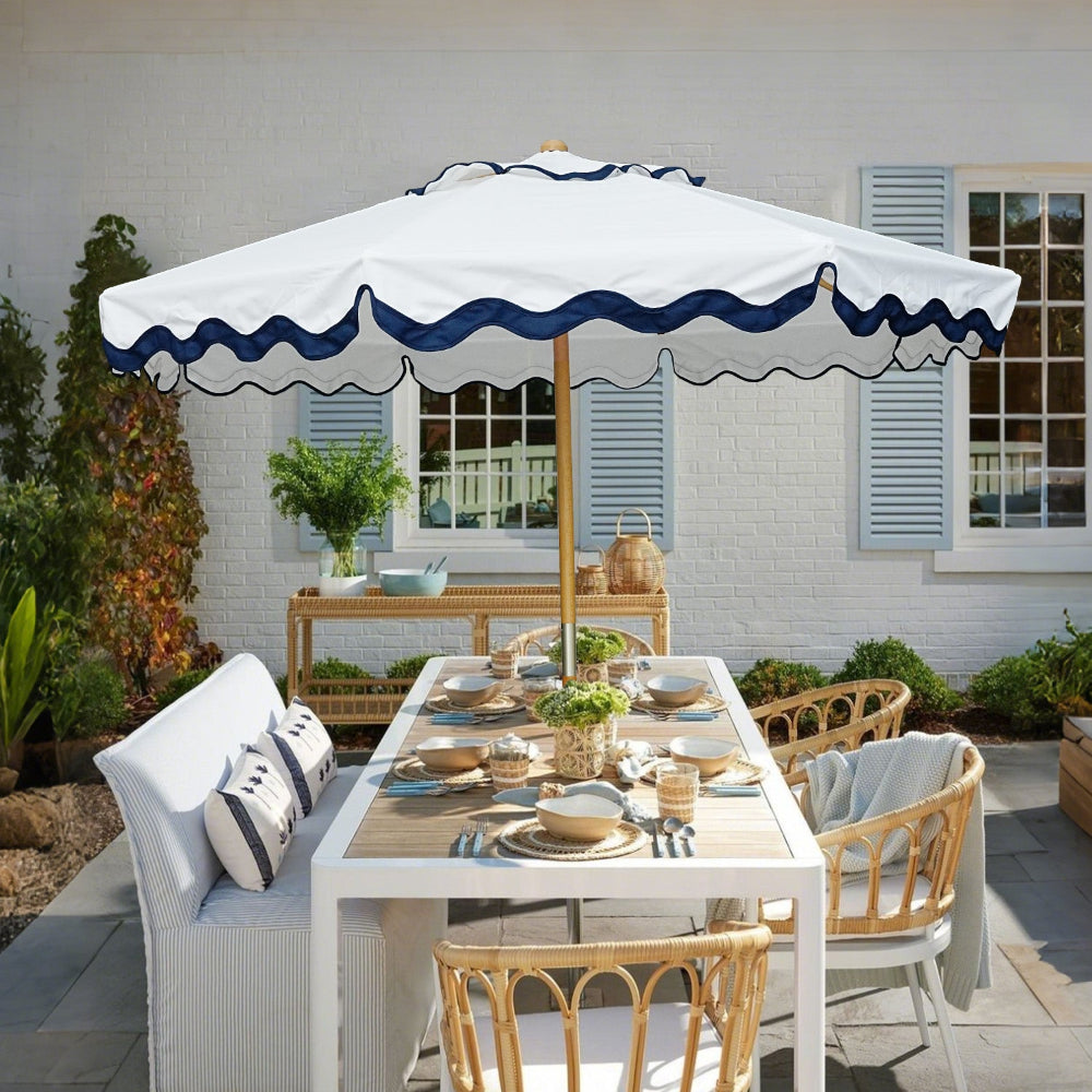 Outdoor dining setup with AMMSUN large beach umbrella for patio, table, chairs, and a bench in a garden setting.