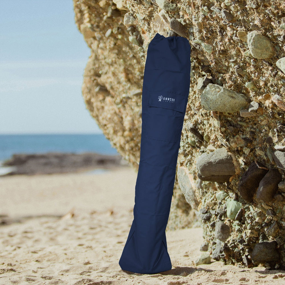 AMMSUN navy blue golf bag umbrella for beach umbrella resting on a rock
