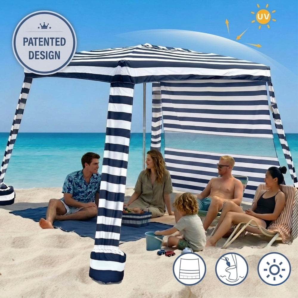 A family of 5 relaxing under an AMMSUN 8'x8' navy blue stripe extra large beach tent cabana portable with side wall umbrella on sand
