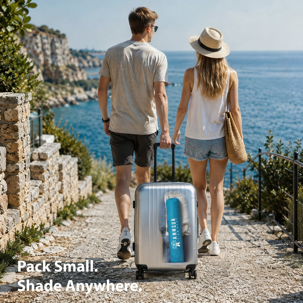 A man and a woman, carrying a suitcase with AMMSUN 6.5ft twice foled portable umbrella with stand in a small pack