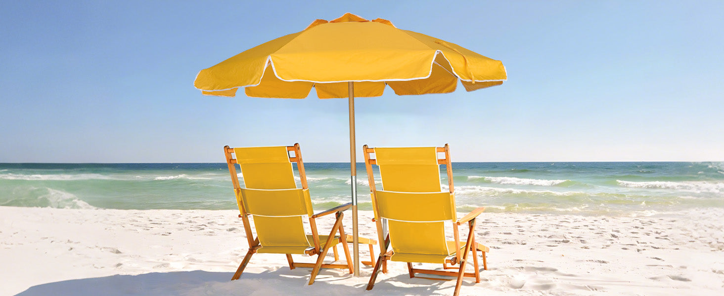 Two yellow chairs and an AMMSUN beach umbrella portable on a sandy beach.