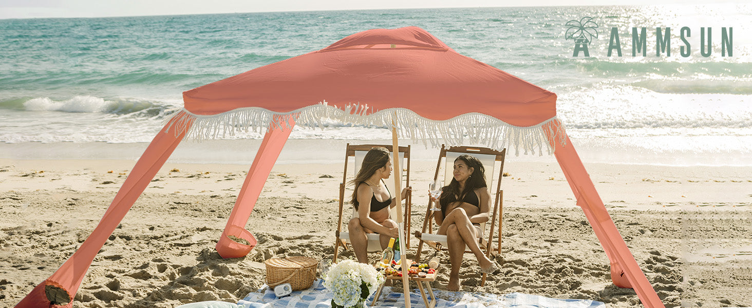 Two women sitting in AMMSUN coolcabanas beach canopy 7ftx7ft vintage pink tent canopy with fringe