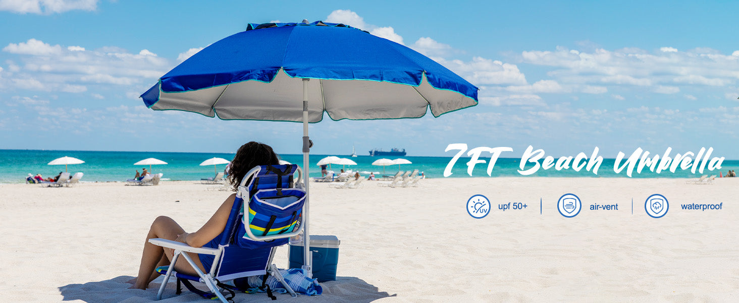 A woman enjoying beacday with an AMMSUN 7ft blue heavy duty patio umbrella for beach with sand anchor