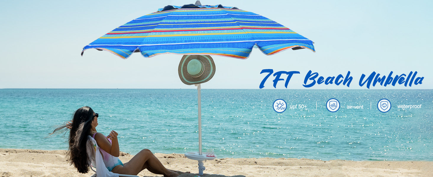 A woman lying under AMMSUN 7ft tear green heavy duty umbrellas for rain with sand anchor on beach