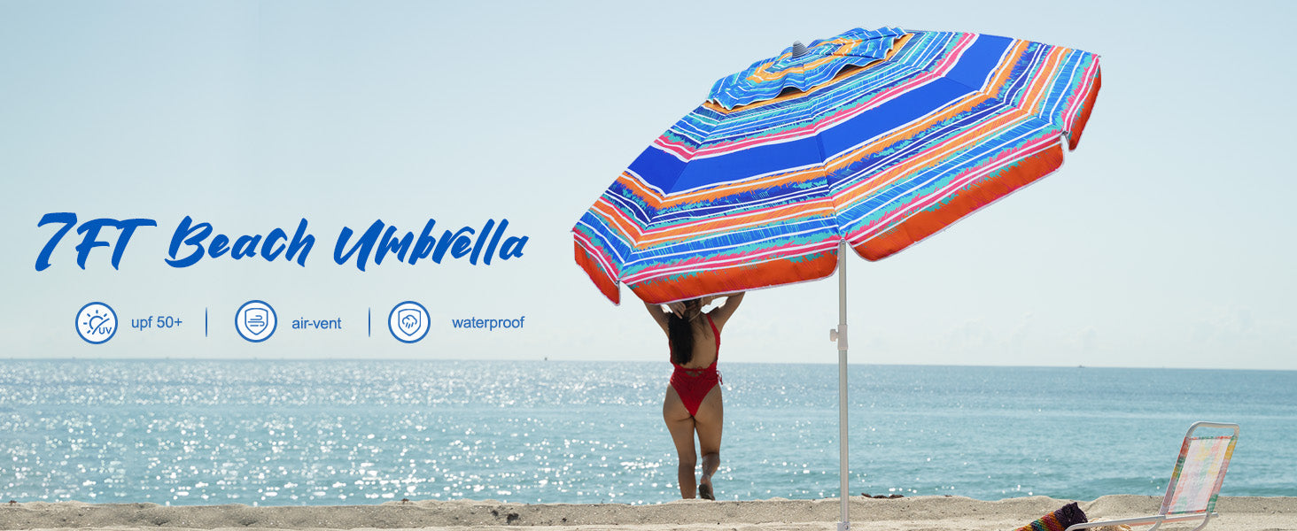 A woman having her holiday with AMMSUN 7ft caribbean twilight large outdoor umbrella with sand anchor