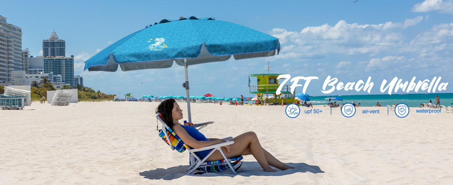A woman enjoying beach day with AMMSUN 7ft sky whirlpool teal sun umbrella uv protection with stand