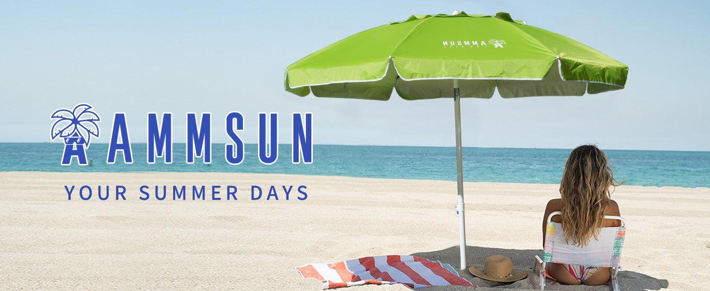 A woman sitting under AMMSUN 6.5ft green beach umbrella for patio with tilt on beach