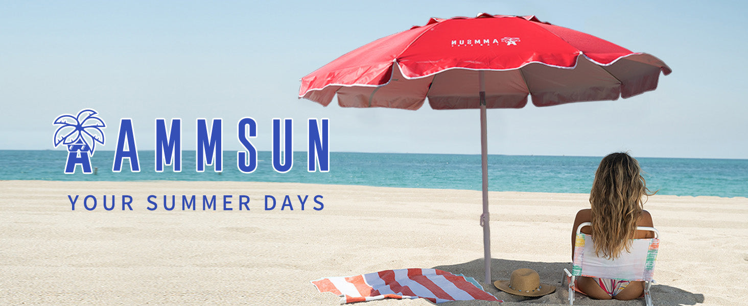 A woman relaxing under AMMSUN 6.5ft red picnic umbrella portable beach umbrella