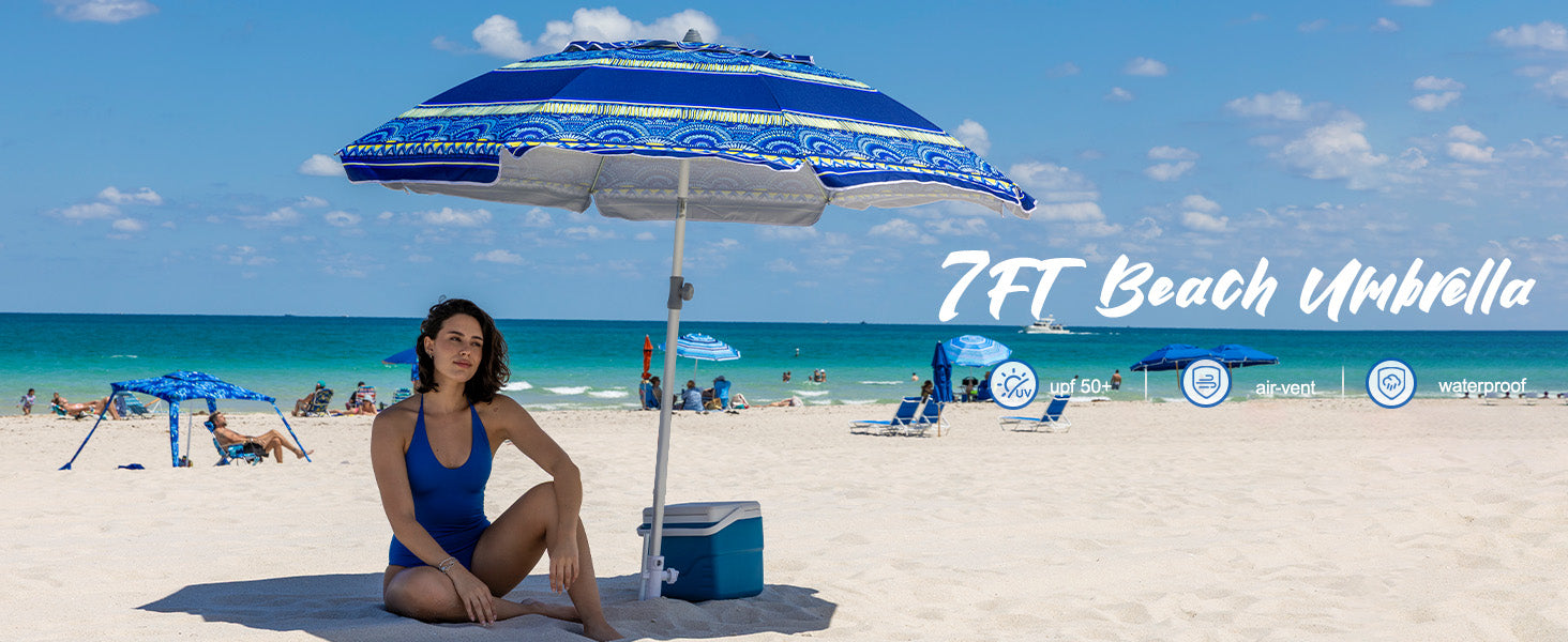 A woman relaxing under AMMSUN 7ft rivival blues beach umbrellas for sand with sand anchor, enjoying the sun