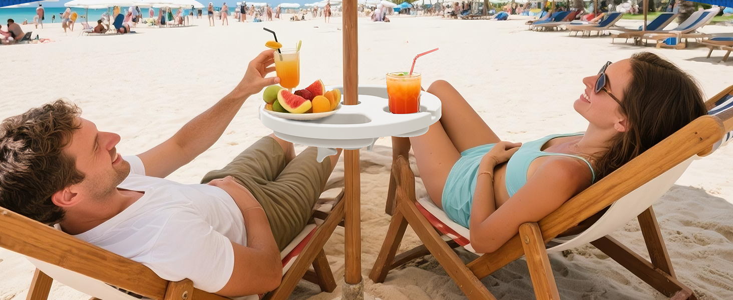 Two people sitting under an umbrella with AMMSUN 13